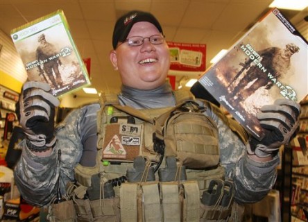 Erik Cota walks out of the video store with his copy of Call of Duty Modern Warfare 2 video game, early Tuesday, Nov. 10, 2009 in Redwood City, Calif. Modern Warfare 2 was launched Tuesdayat one minute after midnight. (AP Photo/George Nikitin)